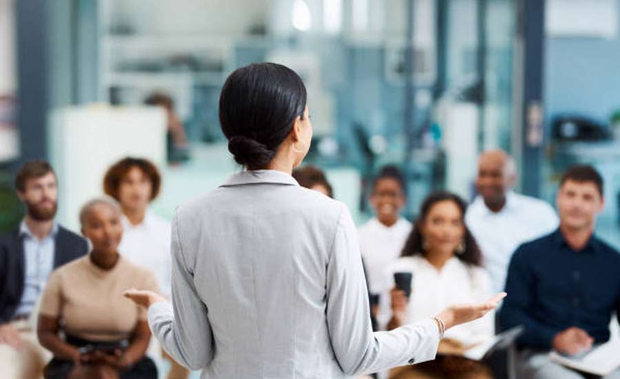 Business presentation in a modern office setting, highlighting team collaboration and leadership.