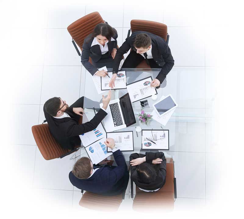 Top view of a business meeting with professionals discussing around a table